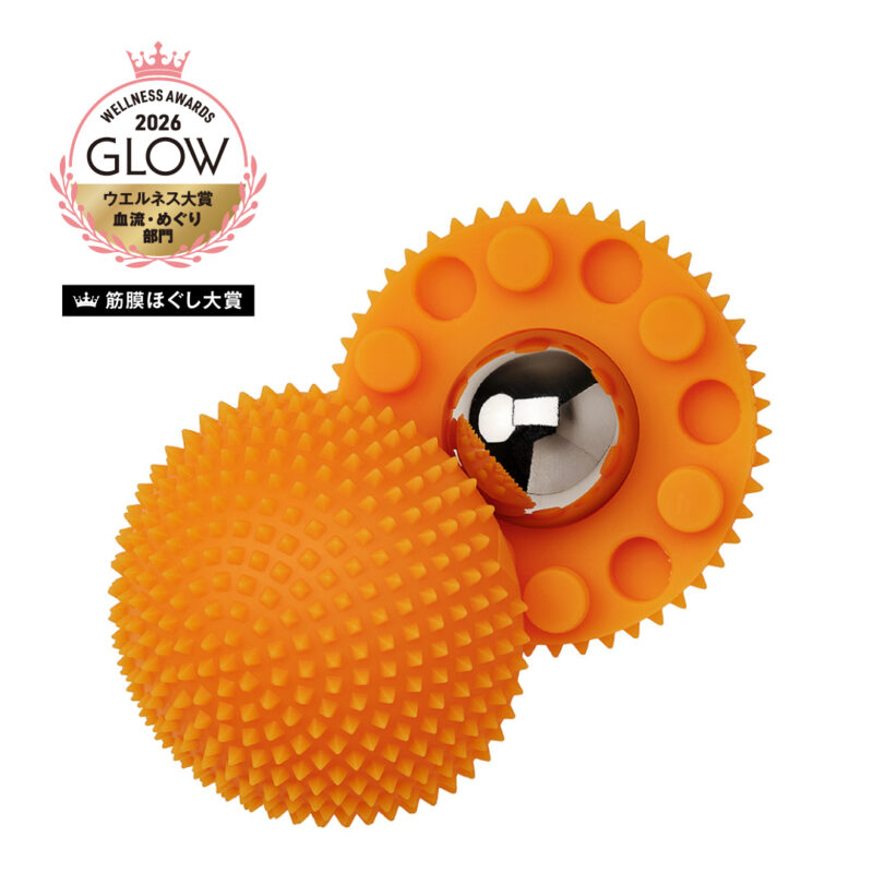 Orange two-piece massage ball set: a spiky textured ball connected to a gear-like piece with a shiny metal core in the center.